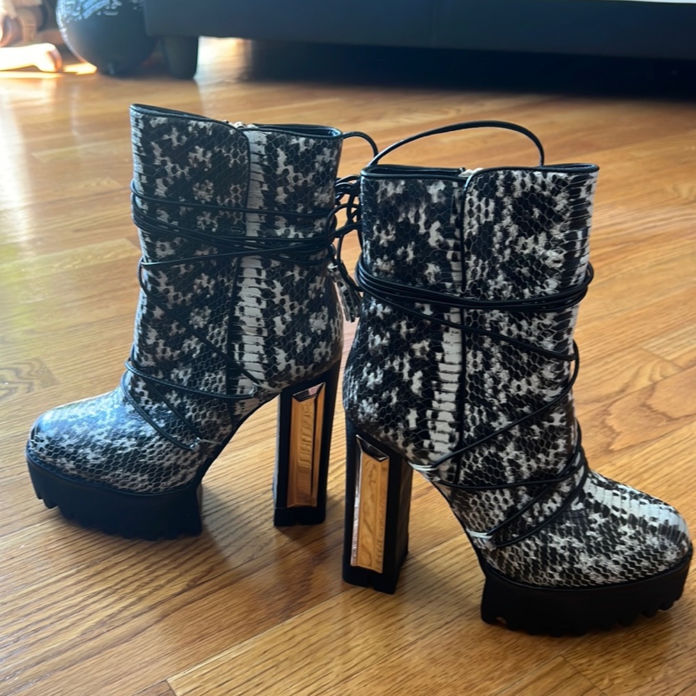 Brand new boots.  Snake skin pattern. Stunning